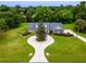 Aerial view of house showcasing unique driveway and landscaping at 1945 Sw 40Th Pl, Ocala, FL 34471