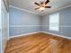 Bright bedroom featuring hardwood floors and ample closet space at 1945 Sw 40Th Pl, Ocala, FL 34471