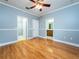 Spacious bedroom with wood floors and ensuite bathroom access at 1945 Sw 40Th Pl, Ocala, FL 34471