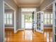 Bright entryway with hardwood floors and open view to backyard at 1945 Sw 40Th Pl, Ocala, FL 34471