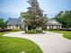 House exterior with circular driveway and landscaping at 1945 Sw 40Th Pl, Ocala, FL 34471