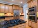 Modern kitchen with stainless steel appliances and granite countertops at 1945 Sw 40Th Pl, Ocala, FL 34471