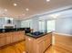 Kitchen with island, granite countertops, and light wood cabinets at 1945 Sw 40Th Pl, Ocala, FL 34471