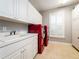 Laundry room with washer, dryer, and storage at 1945 Sw 40Th Pl, Ocala, FL 34471