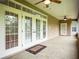 Spacious screened porch with tile flooring and French doors at 1945 Sw 40Th Pl, Ocala, FL 34471