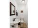 Small bathroom with pedestal sink and toilet at 21959 Nw 6Th St, Dunnellon, FL 34431