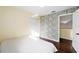 Spacious bedroom with wood-look floors and access to upper level at 21959 Nw 6Th St, Dunnellon, FL 34431