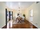 Formal dining room with hardwood floors and a lovely chandelier at 21959 Nw 6Th St, Dunnellon, FL 34431