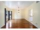 Bright dining room featuring hardwood floors and large windows at 21959 Nw 6Th St, Dunnellon, FL 34431
