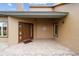 House's front entrance with a brown door and tiled porch at 21959 Nw 6Th St, Dunnellon, FL 34431