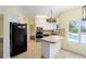 Updated kitchen with stainless steel appliances and breakfast bar at 21959 Nw 6Th St, Dunnellon, FL 34431