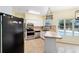 Galley kitchen with stainless steel appliances and pool view at 21959 Nw 6Th St, Dunnellon, FL 34431