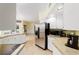 Kitchen with stainless steel appliances and tile flooring at 21959 Nw 6Th St, Dunnellon, FL 34431
