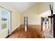 Large living room with hardwood floors and a stone fireplace at 21959 Nw 6Th St, Dunnellon, FL 34431