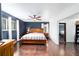 Spacious main bedroom with dark wood floors and a king-size bed at 21959 Nw 6Th St, Dunnellon, FL 34431