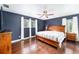 Large main bedroom with dark wood floors and ceiling fan at 21959 Nw 6Th St, Dunnellon, FL 34431