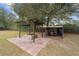 Pergola with fire pit and equipment shed at 21959 Nw 6Th St, Dunnellon, FL 34431