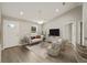 Living room with hardwood floors and staged furniture at 22043 Sw Rainbow Lakes Blvd, Dunnellon, FL 34431