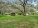 Serene backyard with gazebo, pool, and lush landscaping at 10502 Se 29Th Ave, Ocala, FL 34480