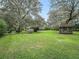 Expansive backyard with gazebo and mature trees at 10502 Se 29Th Ave, Ocala, FL 34480