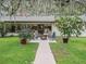 Relaxing patio with fire pit, surrounded by lush landscaping at 10502 Se 29Th Ave, Ocala, FL 34480