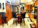 Well-equipped kitchen with wood cabinets and a breakfast bar at 10502 Se 29Th Ave, Ocala, FL 34480