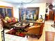 Elegant living room featuring ornate furniture and a large statement painting at 10502 Se 29Th Ave, Ocala, FL 34480