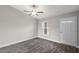 Living area with vinyl flooring, neutral walls, and a ceiling fan at 330 Locust Pass, Ocala, FL 34480