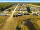 Aerial view showing home's location in a residential neighborhood with a pond nearby at 3321 Sw 153Rd Place Rd, Ocala, FL 34473