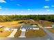 Aerial view of house with pond, and neighboring houses at 3321 Sw 153Rd Place Rd, Ocala, FL 34473