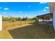 Sunny backyard with screened patio and garden space at 3321 Sw 153Rd Place Rd, Ocala, FL 34473
