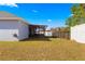 Backyard with grassy area, screened patio, and fence at 3321 Sw 153Rd Place Rd, Ocala, FL 34473