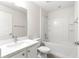 Clean bathroom with white tub, shower, and vanity at 3321 Sw 153Rd Place Rd, Ocala, FL 34473
