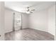Simple bedroom with wood-look floors and ceiling fan at 3321 Sw 153Rd Place Rd, Ocala, FL 34473
