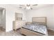 Bright bedroom with wood-look floors, ceiling fan, and dresser at 3321 Sw 153Rd Place Rd, Ocala, FL 34473