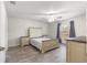 Bedroom with wood-look floors, ceiling fan, and window at 3321 Sw 153Rd Place Rd, Ocala, FL 34473