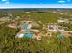 Aerial view of the community featuring tennis courts and clubhouse at 3321 Sw 153Rd Place Rd, Ocala, FL 34473