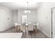 Bright dining room with a wooden table and six chairs at 3321 Sw 153Rd Place Rd, Ocala, FL 34473