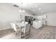 Dining room with light flooring and chandelier, open to kitchen at 3321 Sw 153Rd Place Rd, Ocala, FL 34473