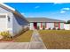 House exterior with red door and landscaping at 3321 Sw 153Rd Place Rd, Ocala, FL 34473