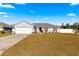 Two-car garage and a well-maintained lawn at 3321 Sw 153Rd Place Rd, Ocala, FL 34473