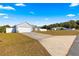 Cute house with a large driveway and white fence at 3321 Sw 153Rd Place Rd, Ocala, FL 34473