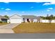 Single-story house with a two-car garage and a well-maintained front yard at 3321 Sw 153Rd Place Rd, Ocala, FL 34473
