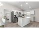 Open concept kitchen with island and stainless steel appliances at 3321 Sw 153Rd Place Rd, Ocala, FL 34473