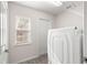 Laundry room with washer, dryer, and exterior access at 3321 Sw 153Rd Place Rd, Ocala, FL 34473