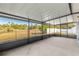 Large screened patio overlooking the backyard at 3321 Sw 153Rd Place Rd, Ocala, FL 34473