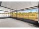 Spacious screened patio with a view of the backyard at 3321 Sw 153Rd Place Rd, Ocala, FL 34473