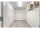 Spacious walk-in closet with built-in shelving and vinyl flooring at 3321 Sw 153Rd Place Rd, Ocala, FL 34473