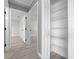 Hallway with wood-look floors and access to other rooms and closet at 3386 Sw 126Th Lane Rd, Ocala, FL 34473