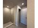 Tiled shower and bathroom with linen closet at 4445 Sw 90Th Pl, Ocala, FL 34476